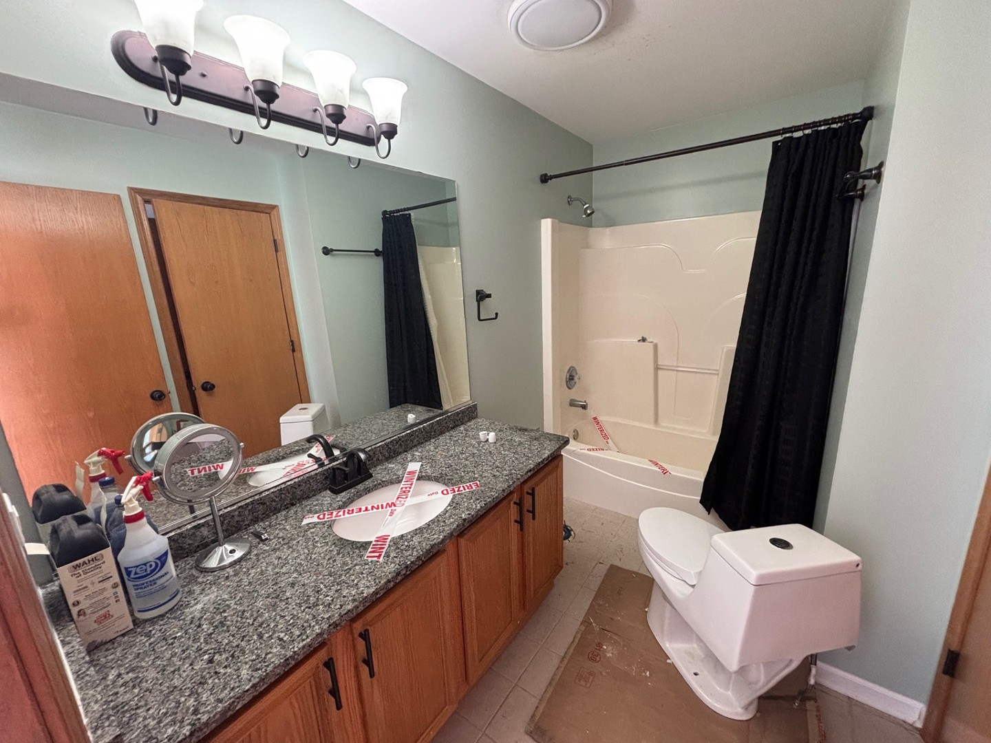 655 Chestnut Ridge Minooka, IL 60447 - Photo 15 of 21 a bathroom with a granite countertop sink a mirror and shower