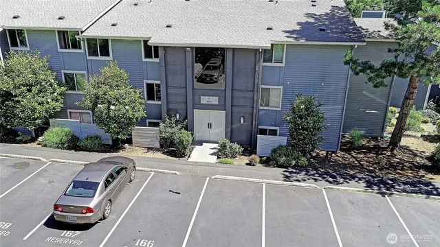 a view of a patio with table and chairs potted plants