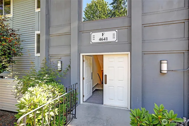 a view of a door and front view of a house