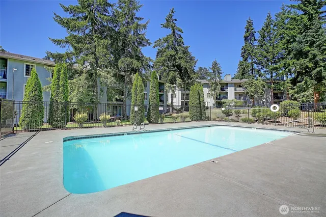 a view of swimming pool and outdoor seating
