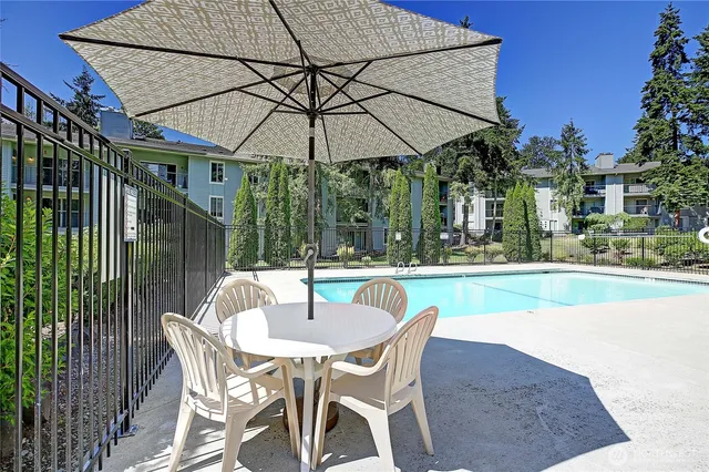 a patio with a yard table and chairs