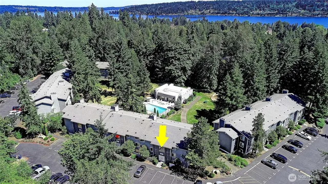 an aerial view of a house with a garden and swimming pool