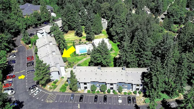 an aerial view of house with yard swimming pool and outdoor seating