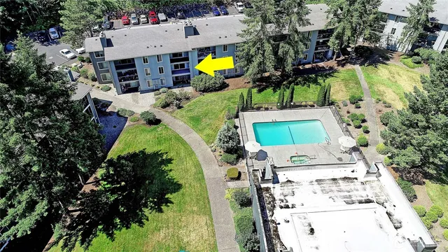 an aerial view of residential house with outdoor space and swimming pool