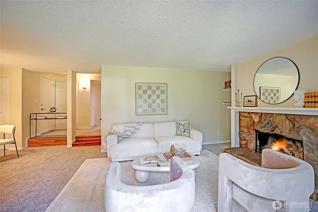 a living room with furniture a fireplace and a fireplace