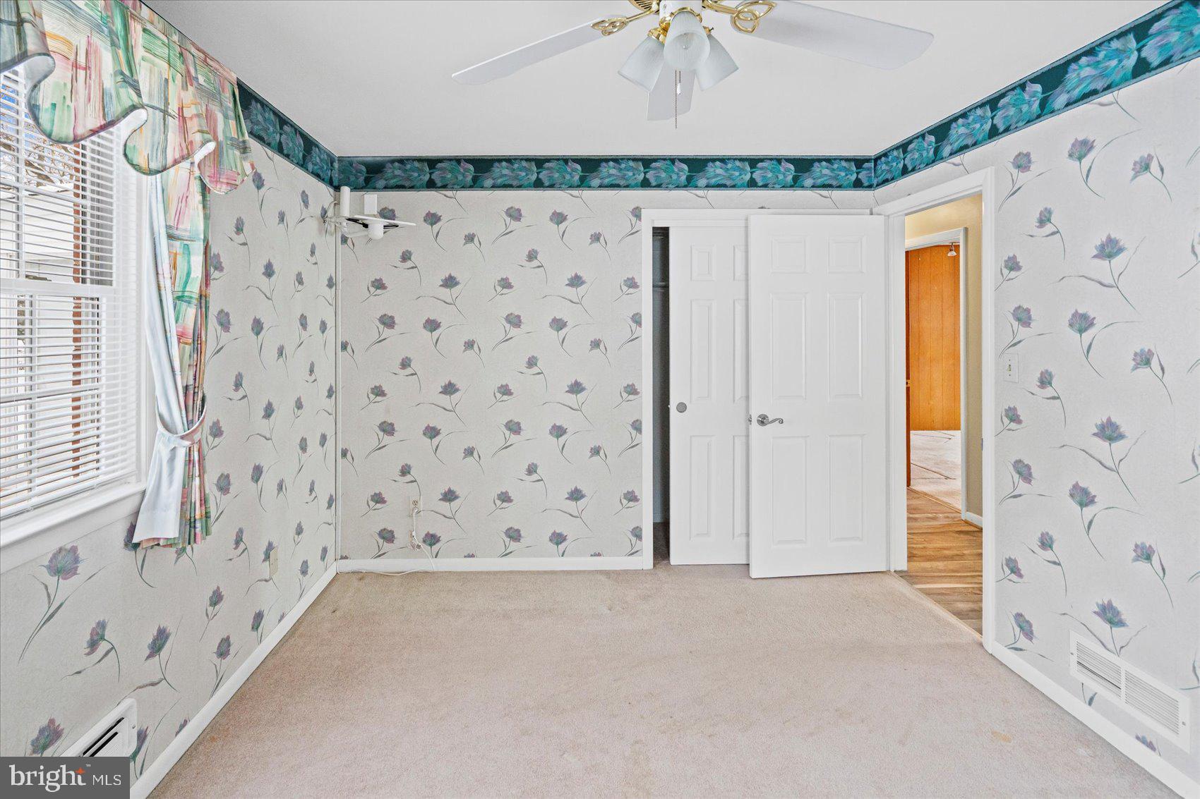 1004 Dunblane Road Baltimore, MD 21286 - Photo 29 of 60 a bathroom with a shower curtain and a window