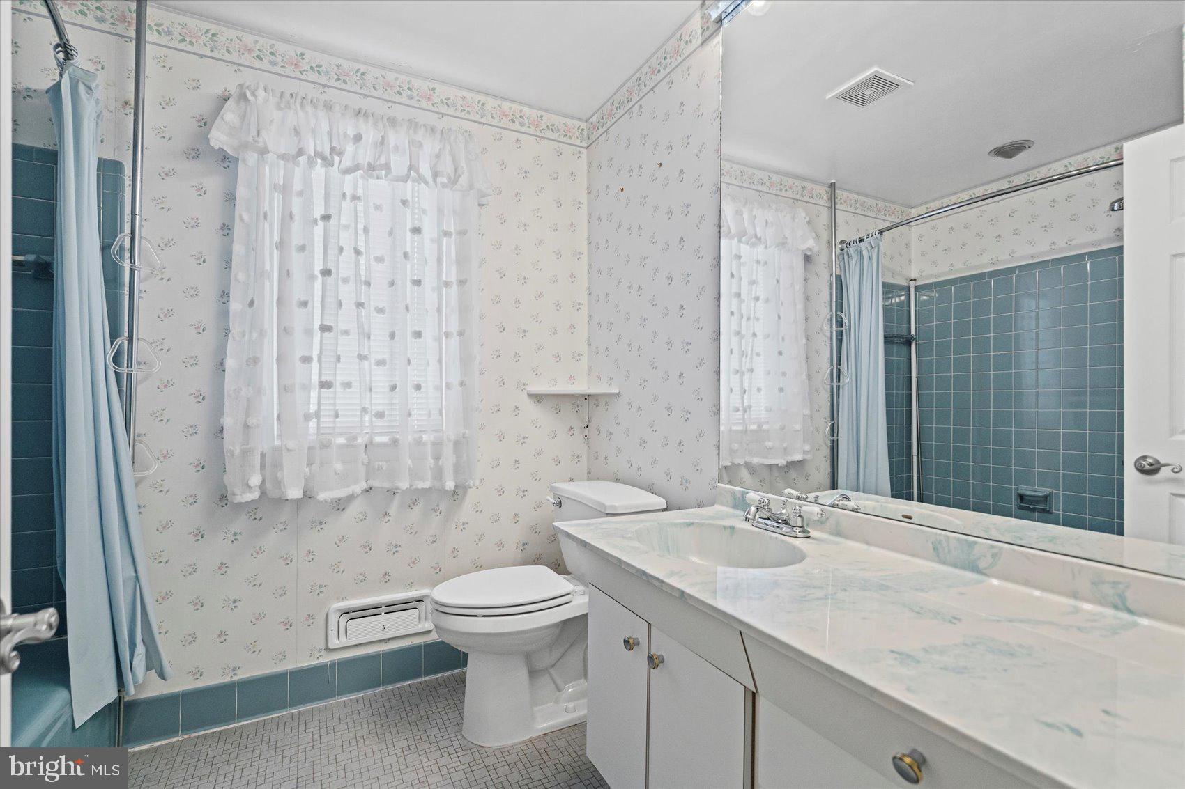 1004 Dunblane Road Baltimore, MD 21286 - Photo 34 of 60 a bathroom with a sink toilet and shower