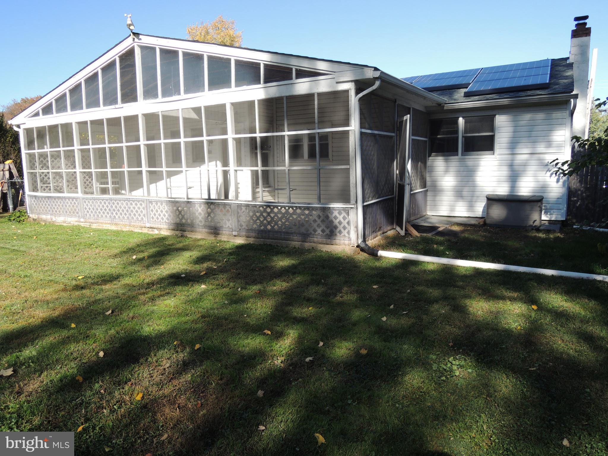 1520 Foster Road Warminster, PA 18974 - Photo 19 of 32 Rear Screened in Porch with doors on opposite ends