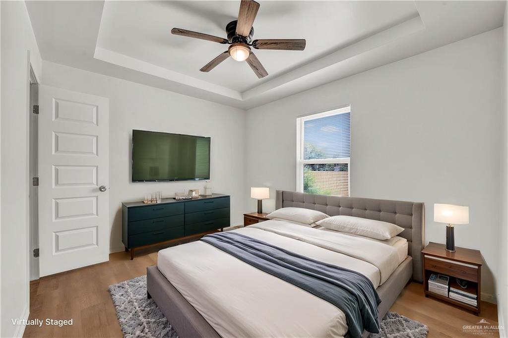 670 West Durham Avenue Raymondville, TX 78580 - Photo 11 of 13 a bedroom with a bed and a flat screen tv