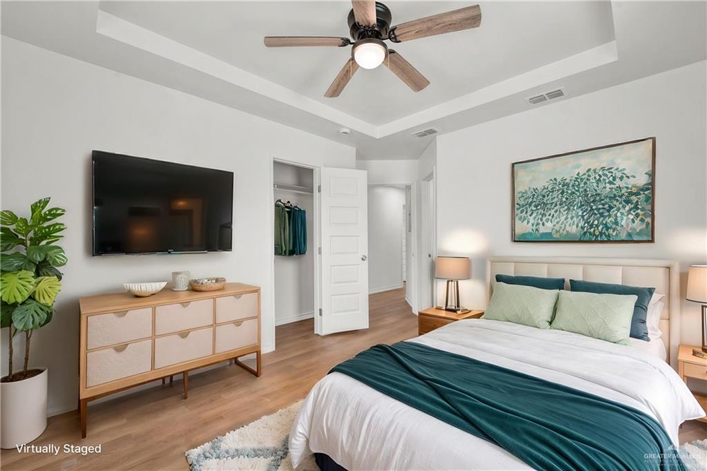 670 West Durham Avenue Raymondville, TX 78580 - Photo 12 of 13 a bedroom with a bed and a flat screen tv