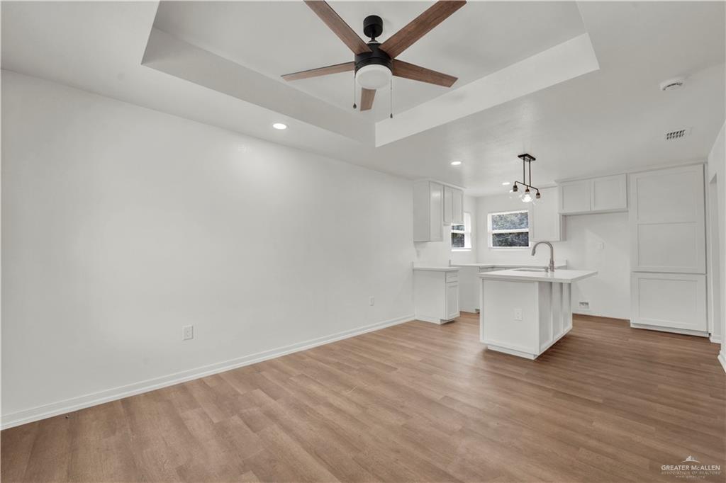 670 West Durham Avenue Raymondville, TX 78580 - Photo 2 of 13 a view of cabinets and wooden floor