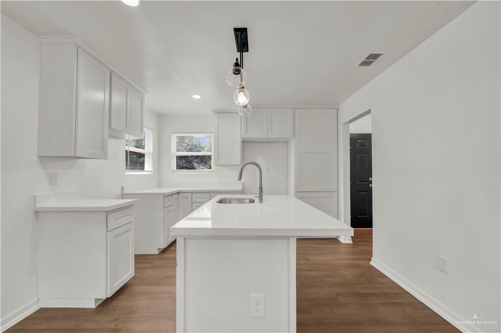 670 West Durham Avenue Raymondville, TX 78580 - Photo 4 of 13 a view of a kitchen with a sink stainless steel appliances and cabinets