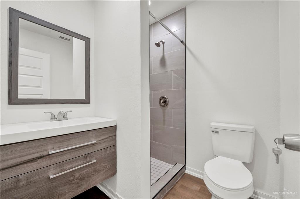 670 West Durham Avenue Raymondville, TX 78580 - Photo 6 of 13 a bathroom with a toilet a sink and shower