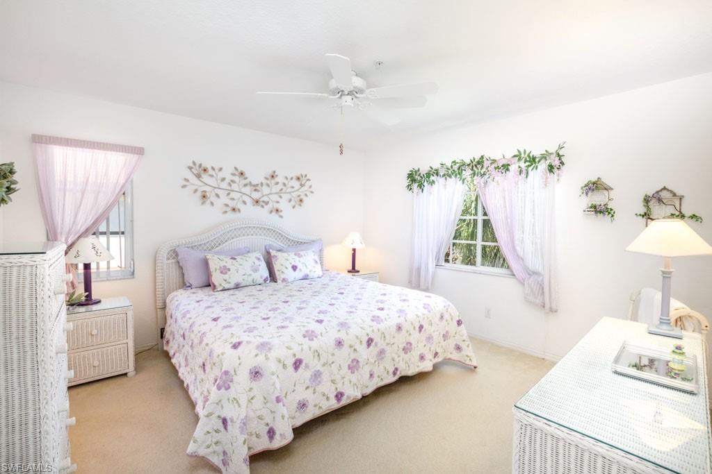 448 Gabriel Circle, Unit 3302 Naples, FL 34104 - Photo 14 of 32 a bedroom with a bed and a window