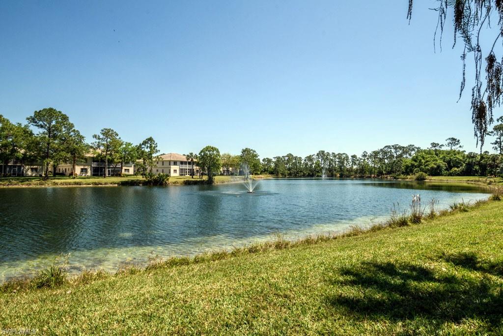 448 Gabriel Circle, Unit 3302 Naples, FL 34104 - Photo 25 of 32 a view of a lake with houses