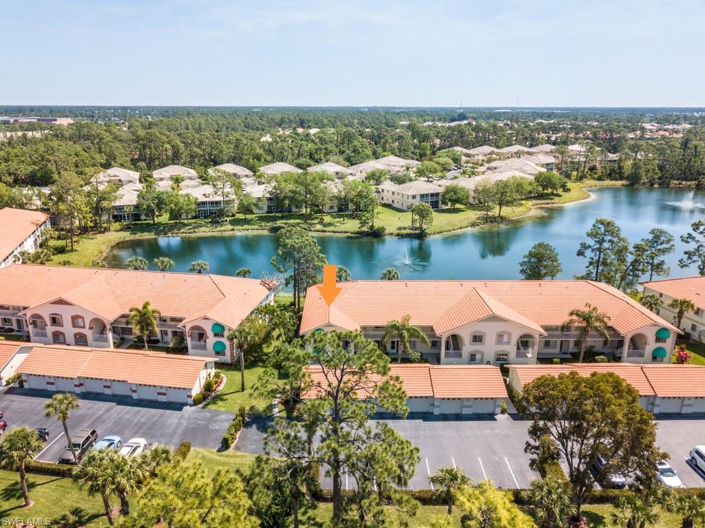 448 Gabriel Circle, Unit 3302 Naples, FL 34104 - Photo 4 of 32 an aerial view of a house with a lake view