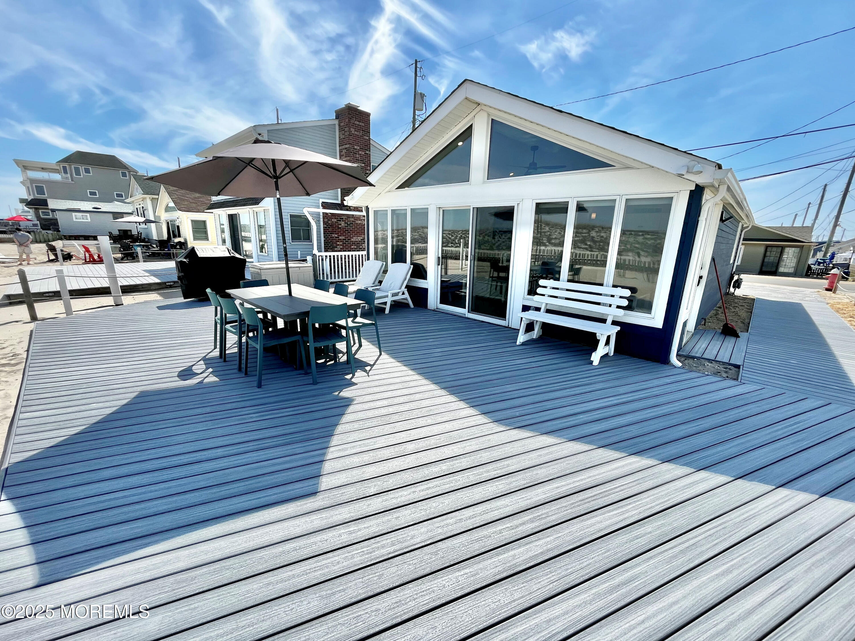 3170 Ocean Road Lavallette, NJ 08735 - Photo 11 of 13 a view of a house with wooden deck and furniture