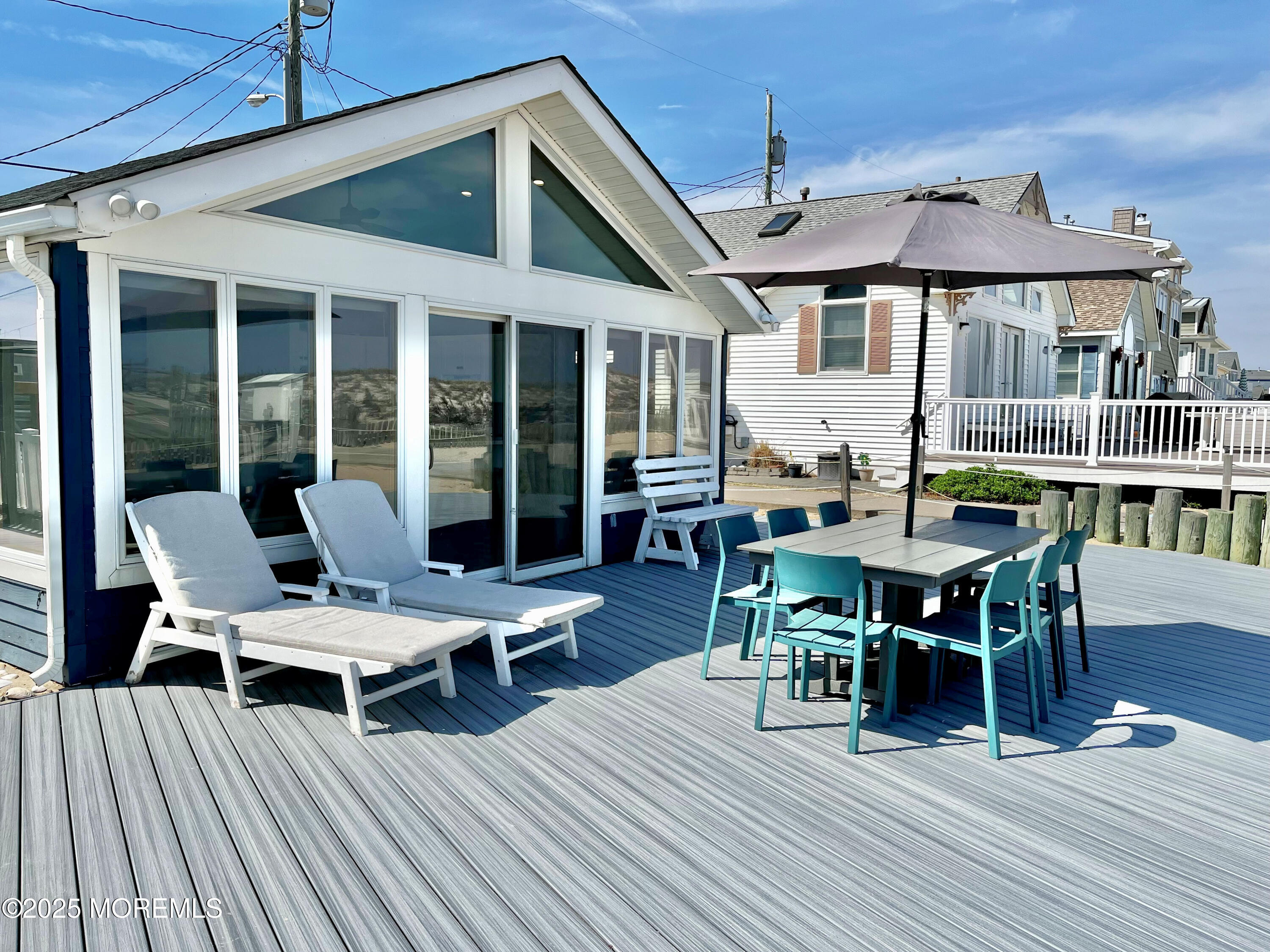 3170 Ocean Road Lavallette, NJ 08735 - Photo 12 of 13 a outdoor space with furniture and wooden floor