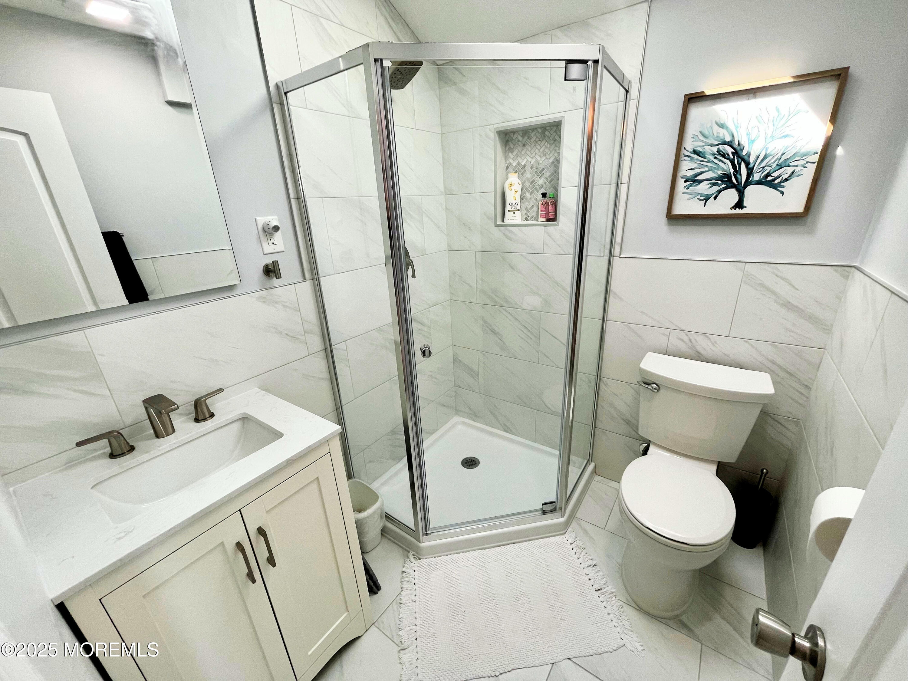 3170 Ocean Road Lavallette, NJ 08735 - Photo 10 of 13 a bathroom with a toilet sink and shower