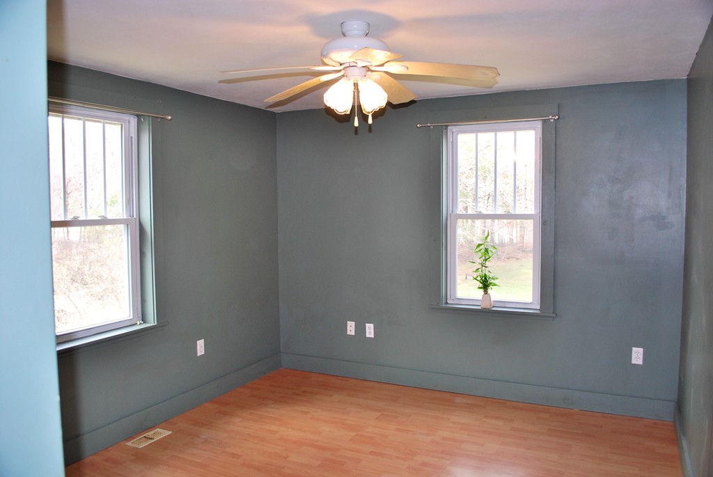 63 Rabbit Road Salisbury, MA 01952 - Photo 4 of 10 a view of an empty room with window and chandelier fan