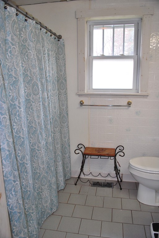 63 Rabbit Road Salisbury, MA 01952 - Photo 7 of 10 a view of a door and chair in a room