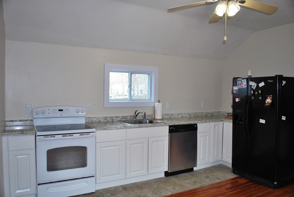 63 Rabbit Road Salisbury, MA 01952 - Photo 8 of 10 a kitchen with stainless steel appliances granite countertop a stove a sink and a refrigerator