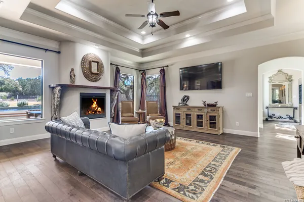 a kitchen with stainless steel appliances kitchen island granite countertop a stove top oven a chimney dining table and chairs