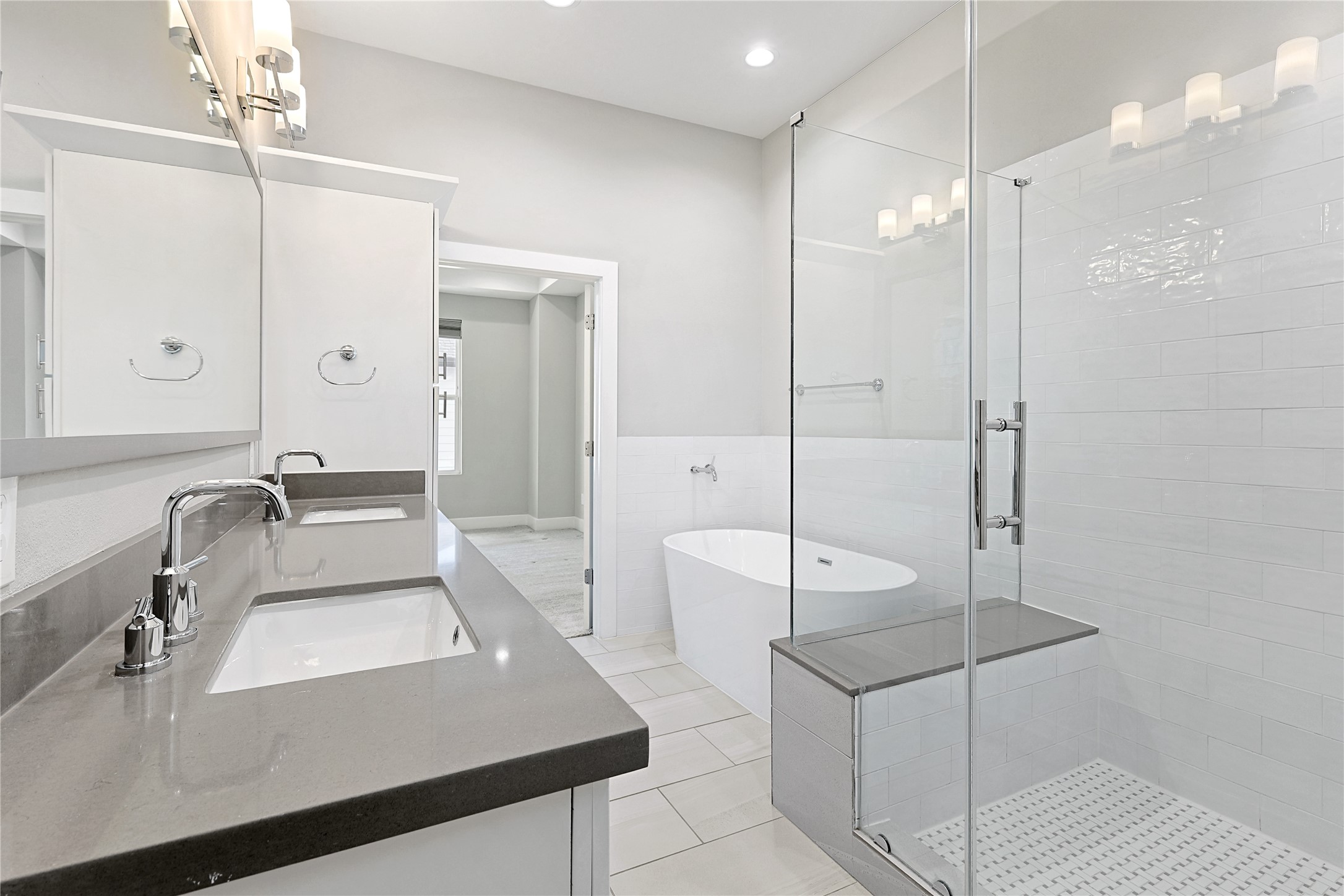 1222 Upton Street Houston, TX 77020 - Photo 22 of 41 Double Sinks, soaking tub, frameless shower and linen cabinet all make this area fell grand.