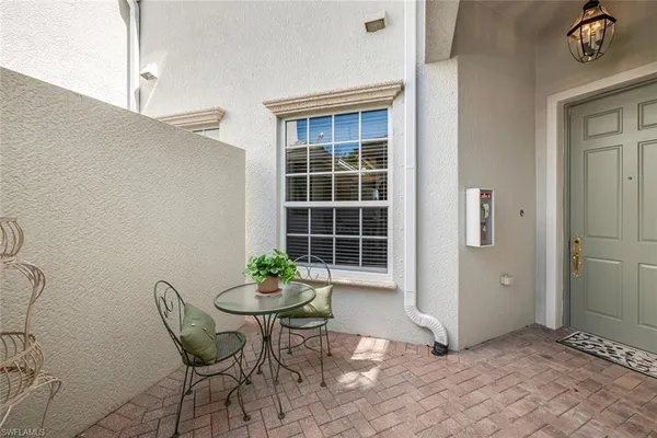 a view of a room that has a table and chair in it