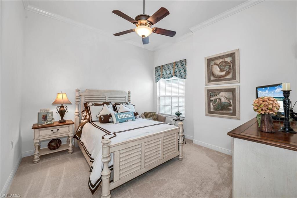 9243 Tesoro Lane, Unit 103 Naples, FL 34114 - Photo 13 of 18 a bedroom with a bed and a tv on the dresser