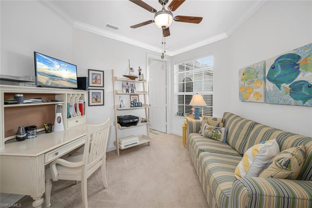 9243 Tesoro Lane, Unit 103 Naples, FL 34114 - Photo 15 of 18 a living room with furniture and a flat screen tv