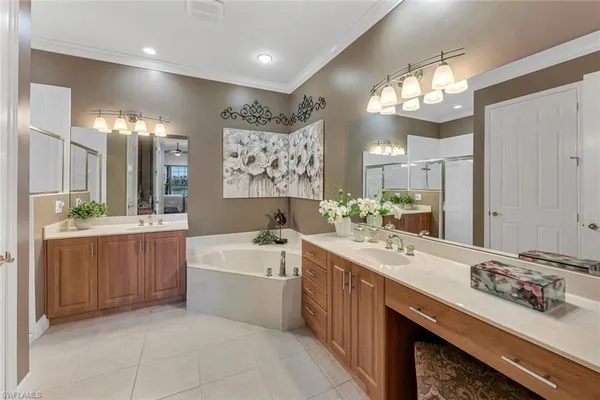 a bathroom with a sink a large mirror and a shower