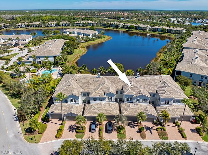 9243 Tesoro Lane, Unit 103 Naples, FL 34114 - Photo 2 of 18 an aerial view of residential houses with outdoor space
