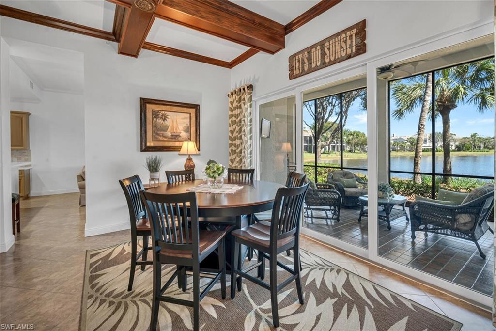 9243 Tesoro Lane, Unit 103 Naples, FL 34114 - Photo 9 of 18 a view of a dining room with furniture window and outside view