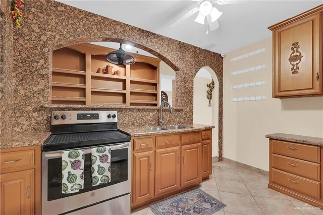 a kitchen with a stove and cabinets