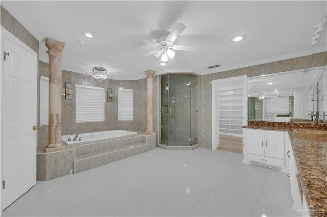 a bathroom with a tub shower and sink