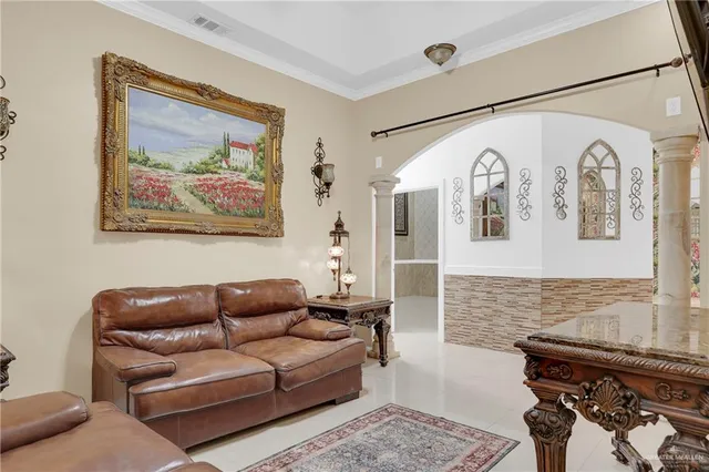 a living room with furniture and wall painting