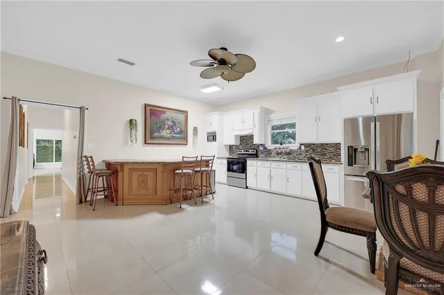 a view of kitchen with furniture and wooden floor