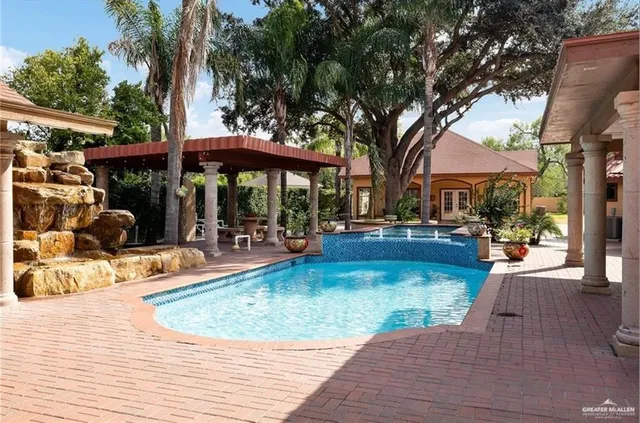 a view of a swimming pool with a patio