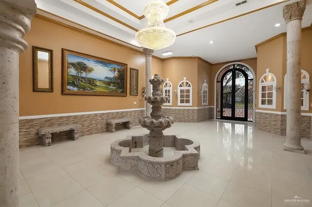 a view of a lobby with furniture and chandelier