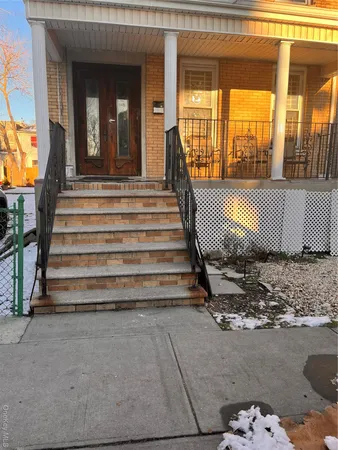 a front view of a house with a rug
