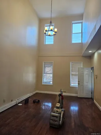 a living room with couch and wooden floor