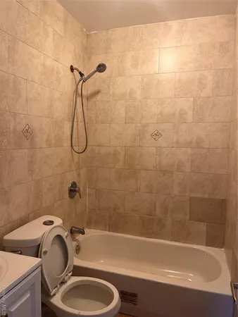 a bathroom with a sink a toilet and a bathtub