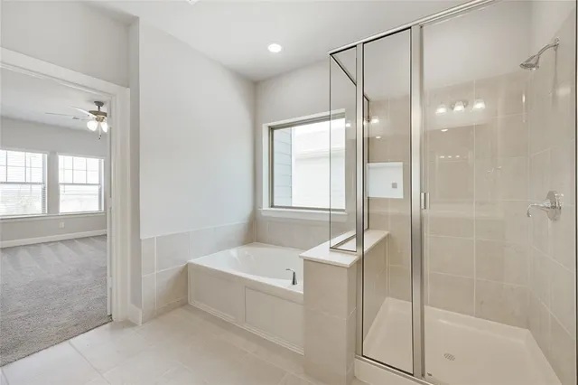 a bathroom with a bathtub and a shower