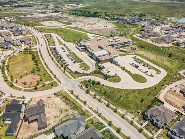 an aerial view of a house with a ocean view