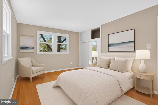 a bedroom with a bed and a couch