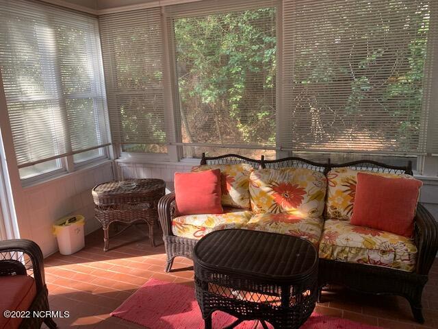 5112 B Greenville Loop Road, Unit B Wilmington, NC 28409 - Photo 7 of 16 Enclosed Sunroom