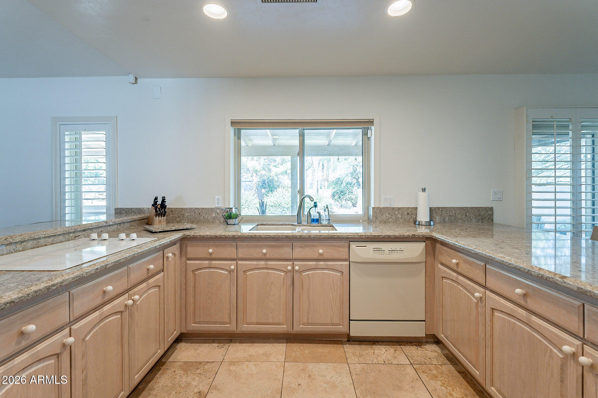 4226 East North Lane Phoenix, AZ 85028 - Photo 16 of 43 a kitchen with a sink stove and cabinets