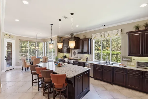 a open kitchen with a table and chairs