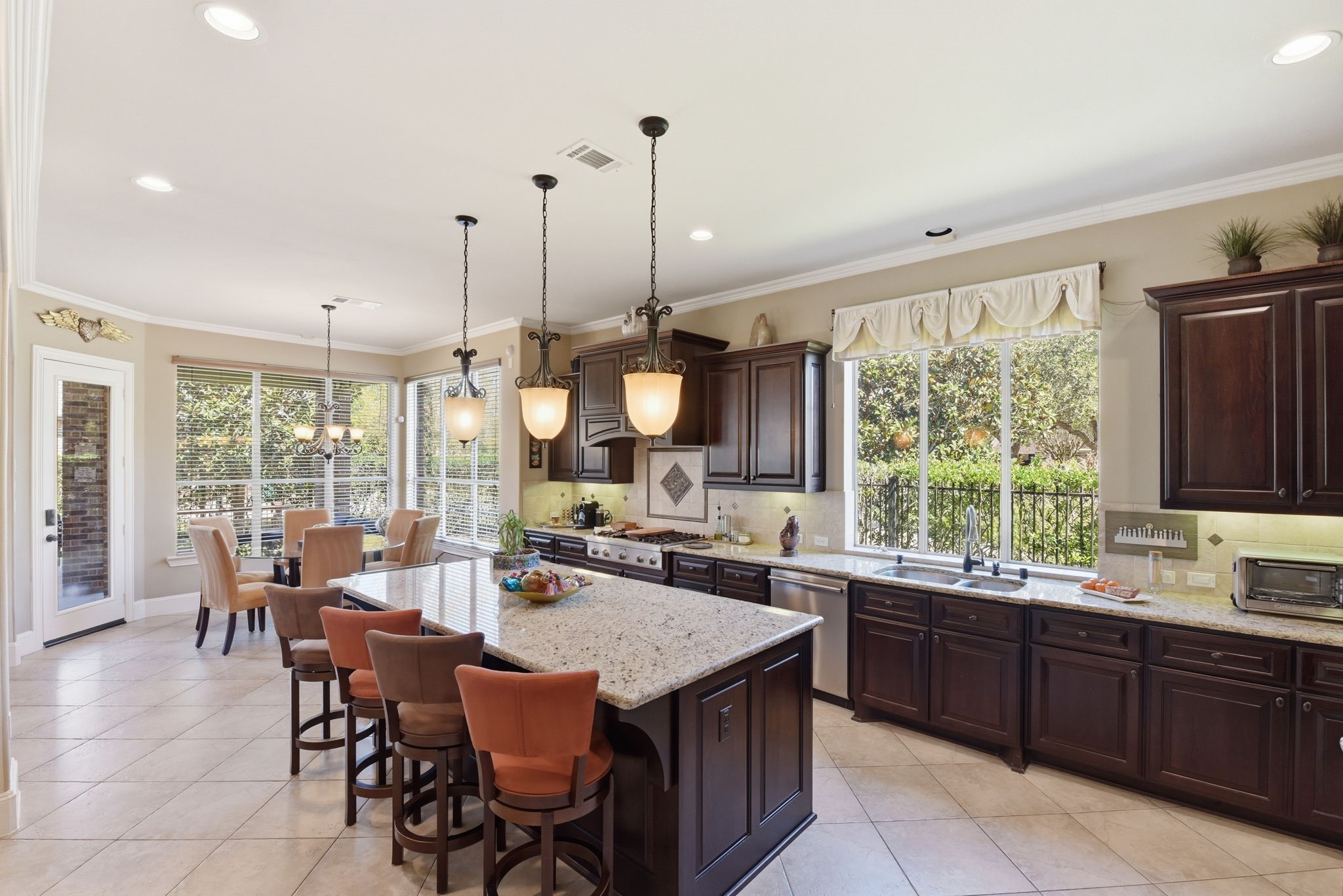 223 South Bauer Point Circle Spring, TX 77389 - Photo 16 of 50 a open kitchen with a table and chairs